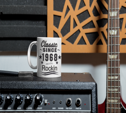 1596717878Resized mockup-of-an-11-oz-coffee-mug-placed-next-to-a-bass-guitar.png